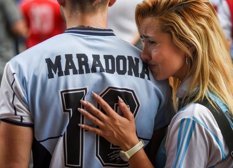 People gather to mourn the death of soccer legend Diego Maradona, outside the Diego Armando Maradona stadium, in Buenos Aires, Argentina November 25, 2020.  REUTERS/Martin Villar  